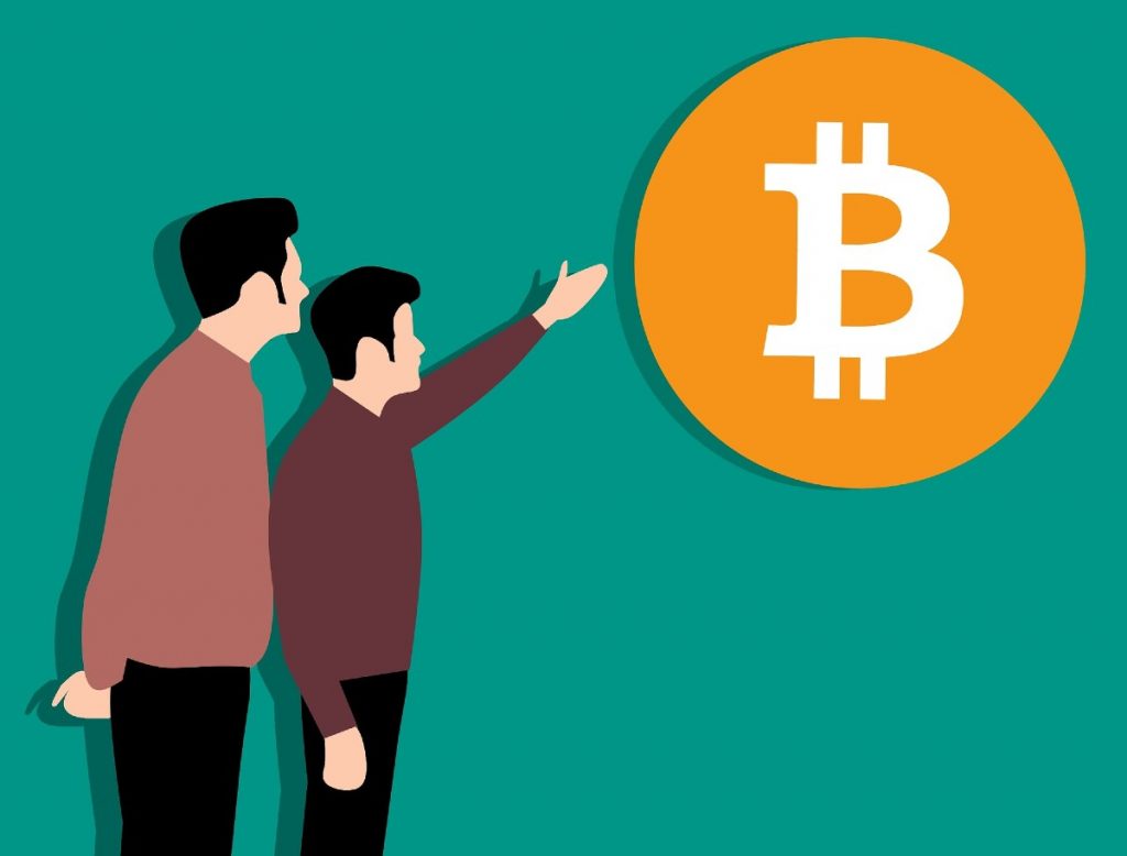 Dos personas hablando sobre Bitcoin (BTC)
